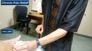 Acupuncturist Steven Sonmore performing acupuncture for depression treatment.