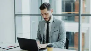 Man at work in suit concentrating.